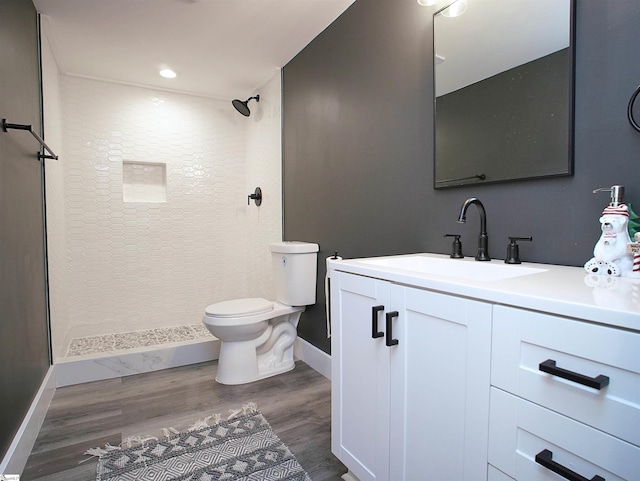 310 Sloping Meadow Dr, Inman, SC 29349 - bathroom featuring wood finished floors, toilet, vanity, baseboards, and a shower