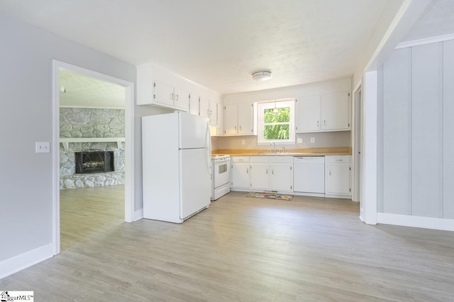 112 Summer Dr, Easley, SC 29642 - kitchen featuring white appliances, light wood-style floors, a sink, light countertops, and white cabinetry