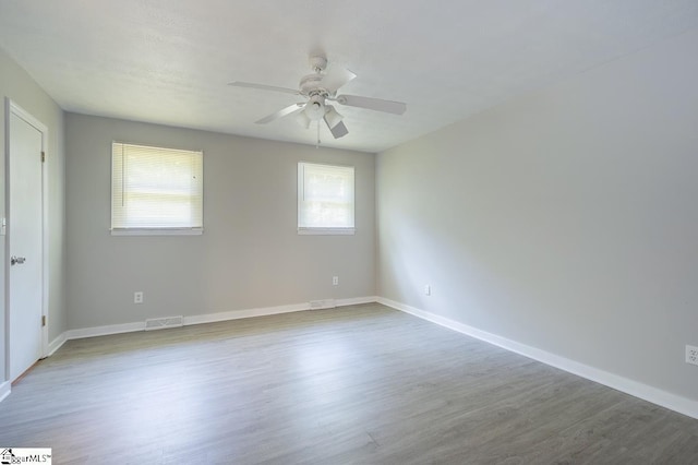 112 Summer Dr, Easley, SC 29642 - unfurnished room with wood finished floors, ceiling fan, and baseboards