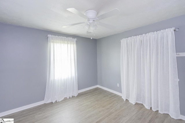 112 Summer Dr, Easley, SC 29642 - empty room with wood finished floors, a ceiling fan, and baseboards
