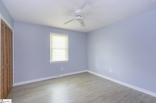 112 Summer Dr, Easley, SC 29642 - unfurnished bedroom with a closet, wood finished floors, baseboards, and a ceiling fan