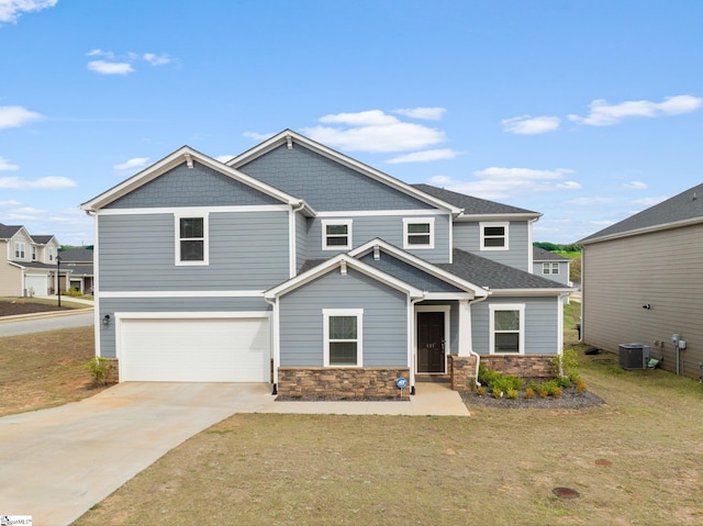 101 Hazelcroft Dr, Fountain Inn, SC 29644 - craftsman inspired home with central AC, an attached garage, stone siding, a front lawn, and concrete driveway