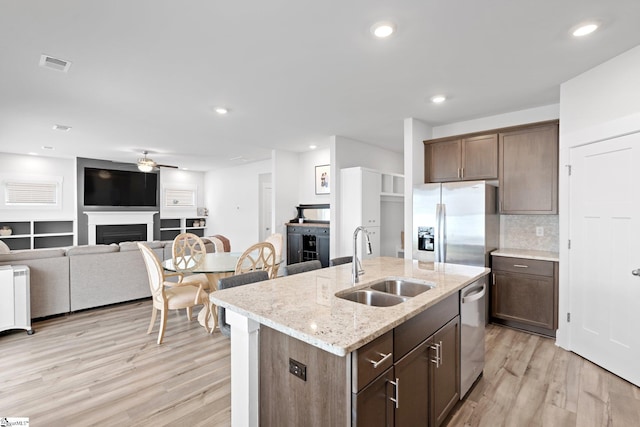 101 Hazelcroft Dr, Fountain Inn, SC 29644 - kitchen featuring a sink, appliances with stainless steel finishes, a ceiling fan, light wood-type flooring, and recessed lighting