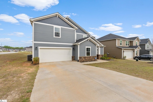 101 Hazelcroft Dr, Fountain Inn, SC 29644 - craftsman inspired home with an attached garage, cooling unit, a front yard, concrete driveway, and stone siding