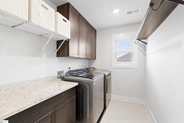 101 Hazelcroft Dr, Fountain Inn, SC 29644 - laundry room featuring washer and dryer, baseboards, cabinet space, light tile patterned floors, and recessed lighting