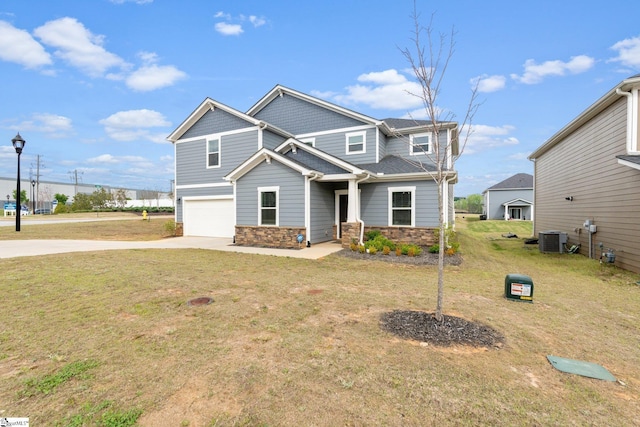 101 Hazelcroft Dr, Fountain Inn, SC 29644 - craftsman-style home with a garage, stone siding, concrete driveway, cooling unit, and a front lawn