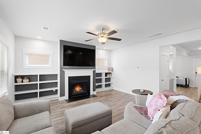 101 Hazelcroft Dr, Fountain Inn, SC 29644 - living room featuring plenty of natural light, a ceiling fan, a fireplace with flush hearth, baseboards, and recessed lighting