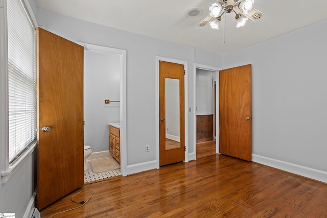 303 Suber Rd, Greer, SC 29651 - unfurnished bedroom with wood finished floors and baseboards