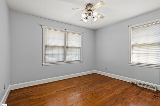 303 Suber Rd, Greer, SC 29651 - spare room featuring baseboards, ceiling fan, healthy amount of natural light, and wood finished floors