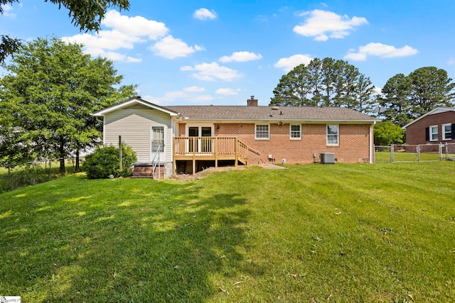 303 Suber Rd, Greer, SC 29651 - back of property featuring central AC unit, a deck, brick siding, and a chimney