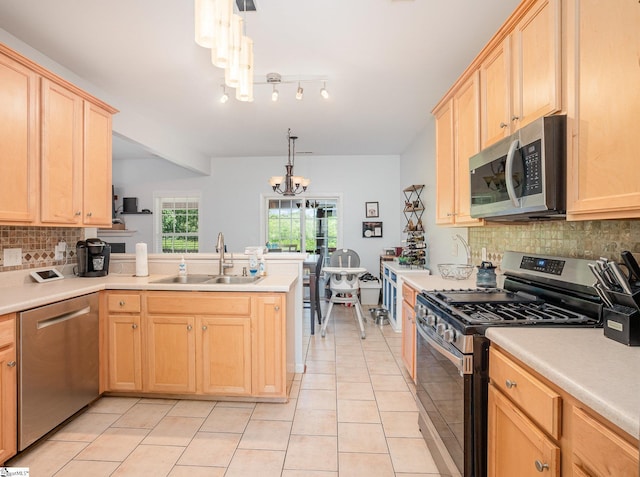 6 Baneberry Ct, Simpsonville, SC 29680 - kitchen with stainless steel appliances, a sink, light brown cabinetry, light tile patterned floors, and a chandelier
