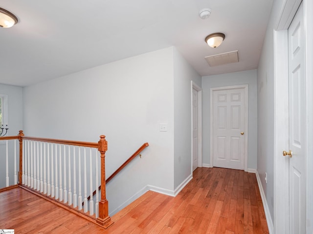 6 Baneberry Ct, Simpsonville, SC 29680 - corridor featuring an upstairs landing, light wood-type flooring, and baseboards
