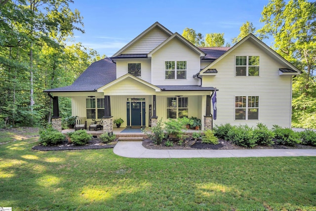 118 Perry Hill Rd, Easley, SC 29640 - view of front of house with covered porch, a front lawn, board and batten siding, and a shingled roof