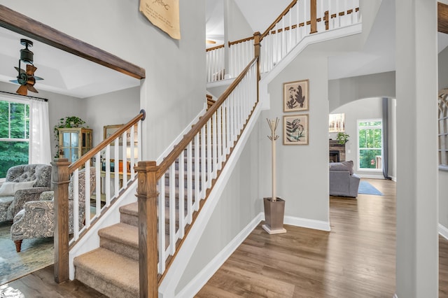 118 Perry Hill Rd, Easley, SC 29640 - stairway featuring a ceiling fan, wood finished floors, arched walkways, and baseboards