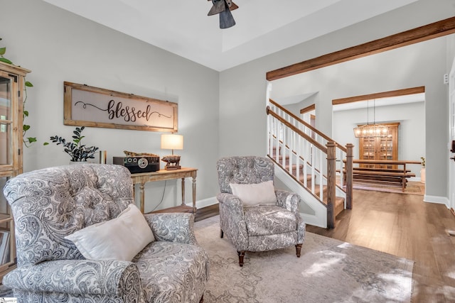 118 Perry Hill Rd, Easley, SC 29640 - living area with wood finished floors, a chandelier, stairway, a ceiling fan, and baseboards