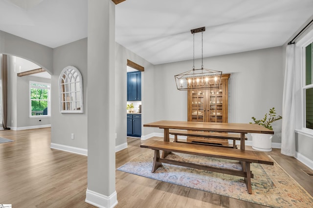 118 Perry Hill Rd, Easley, SC 29640 - dining area featuring arched walkways, light wood-style floors, baseboards, and a chandelier