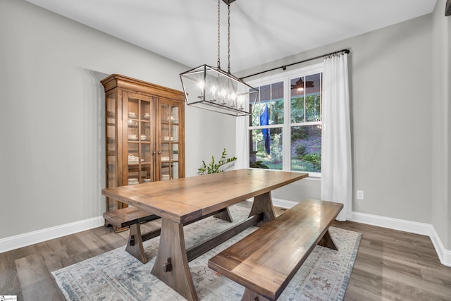 118 Perry Hill Rd, Easley, SC 29640 - dining area with a chandelier, wood finished floors, and baseboards