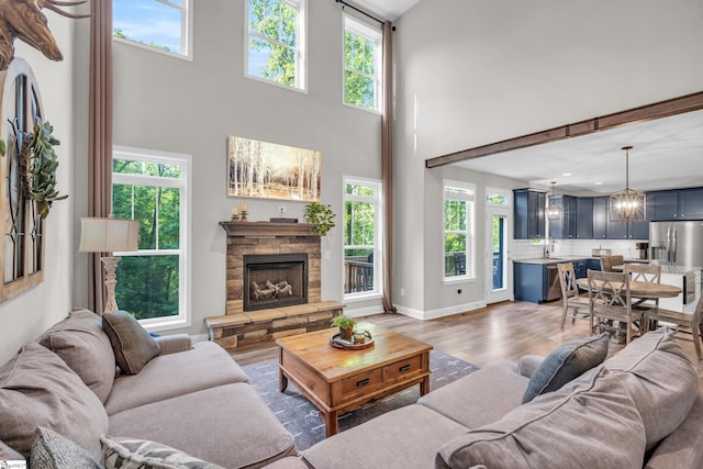 118 Perry Hill Rd, Easley, SC 29640 - living room with wood finished floors, a fireplace, healthy amount of natural light, and a towering ceiling