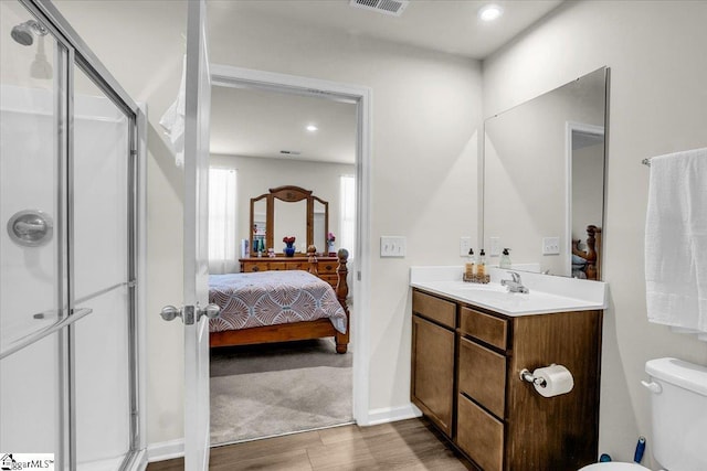 104 Timothy Pl, Easley, SC 29642 - ensuite bathroom with wood finished floors, a stall shower, vanity, toilet, and recessed lighting