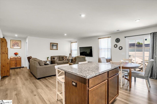 104 Timothy Pl, Easley, SC 29642 - kitchen featuring healthy amount of natural light, a kitchen island, light wood-style floors, and recessed lighting