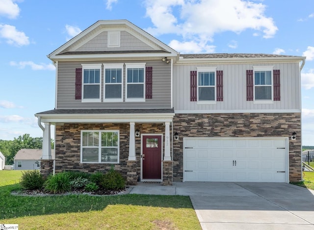 912 Brynderwen Pl, Lyman, SC 29365 - craftsman house featuring stone siding, a front lawn, an attached garage, concrete driveway, and board and batten siding