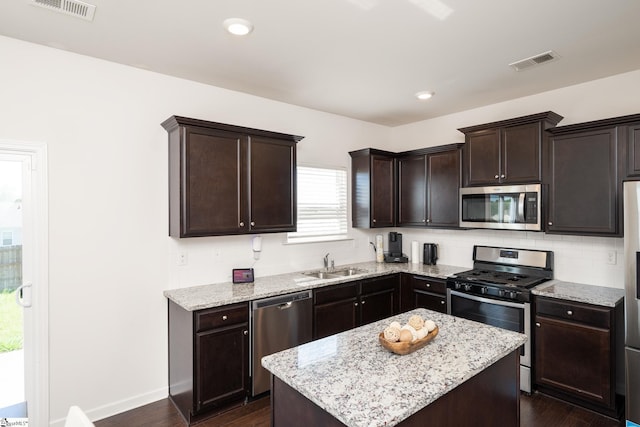 912 Brynderwen Pl, Lyman, SC 29365 - kitchen featuring stainless steel appliances, a sink, dark wood-style flooring, and dark brown cabinetry
