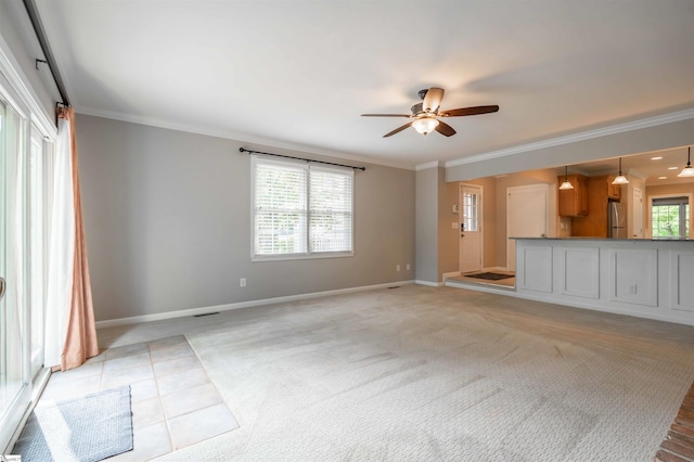 236 S Park Dr, Spartanburg, SC 29302 - unfurnished living room featuring crown molding, a ceiling fan, baseboards, and light colored carpet