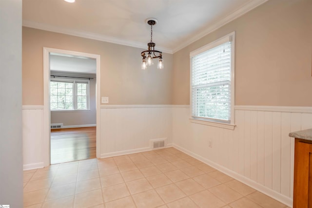 236 S Park Dr, Spartanburg, SC 29302 - unfurnished dining area featuring a wainscoted wall, a chandelier, ornamental molding, and light tile patterned floors