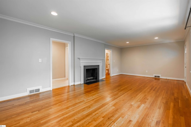 236 S Park Dr, Spartanburg, SC 29302 - unfurnished living room with light wood-style floors, recessed lighting, baseboards, crown molding, and a fireplace with flush hearth