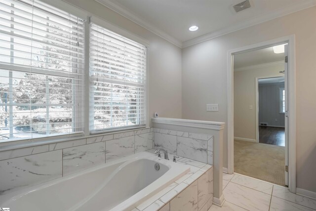 236 S Park Dr, Spartanburg, SC 29302 - bathroom featuring a garden tub, healthy amount of natural light, ornamental molding, marble look tile flooring, and baseboards