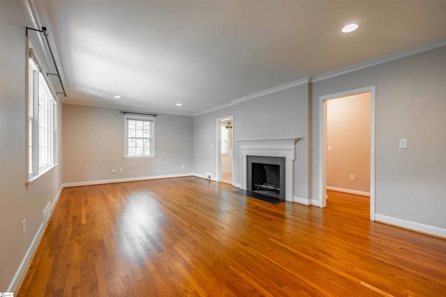 236 S Park Dr, Spartanburg, SC 29302 - unfurnished living room featuring crown molding, wood finished floors, baseboards, recessed lighting, and a fireplace with flush hearth