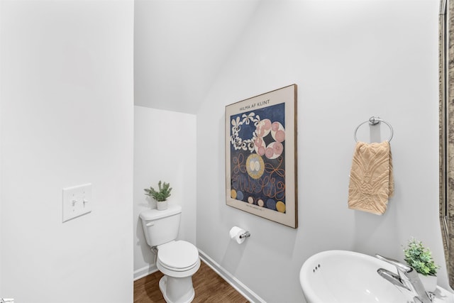 116 Southridge Ct, Easley, SC 29642 - bathroom featuring a sink, wood finished floors, toilet, vaulted ceiling, and baseboards