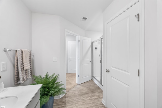 116 Southridge Ct, Easley, SC 29642 - bathroom featuring wood finished floors, a shower stall, and vanity