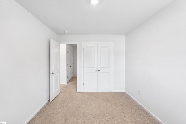 116 Southridge Ct, Easley, SC 29642 - unfurnished bedroom featuring light carpet, baseboards, and a closet