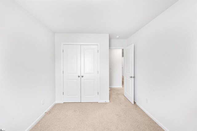116 Southridge Ct, Easley, SC 29642 - unfurnished bedroom with light colored carpet, baseboards, and a closet