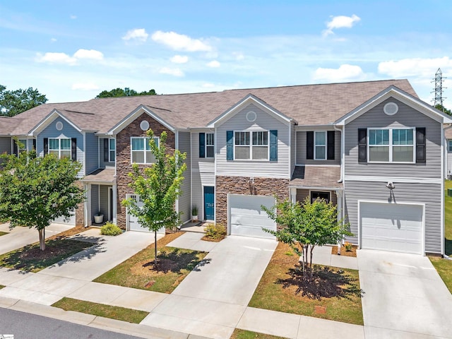 116 Southridge Ct, Easley, SC 29642 - townhome / multi-family property featuring an attached garage, driveway, and stone siding