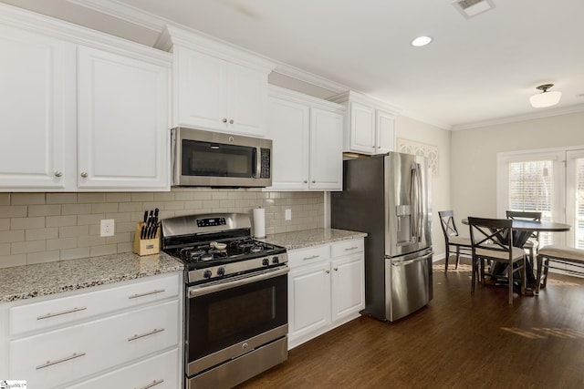 352 Avendell Dr, Easley, SC 29642 - kitchen with stainless steel appliances, dark wood-style floors, tasteful backsplash, white cabinets, and crown molding