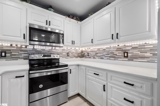 30 Eaglecrest Ct, Simpsonville, SC 29681 - kitchen featuring stainless steel appliances, white cabinetry, and backsplash