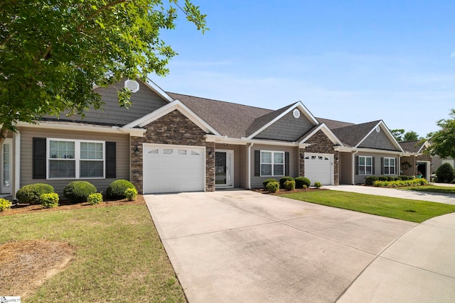 30 Eaglecrest Ct, Simpsonville, SC 29681 - view of front facade featuring a garage, driveway, a front lawn, and stone siding