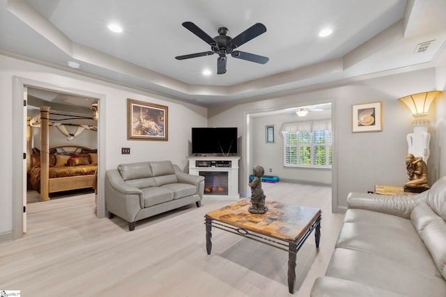 30 Eaglecrest Ct, Simpsonville, SC 29681 - living room featuring a raised ceiling, ceiling fan, light wood-style floors, recessed lighting, and baseboards