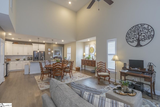 101 Greensdale Ln, Easley, SC 29642 - living area with wood finished floors, a ceiling fan, recessed lighting, a towering ceiling, and baseboards