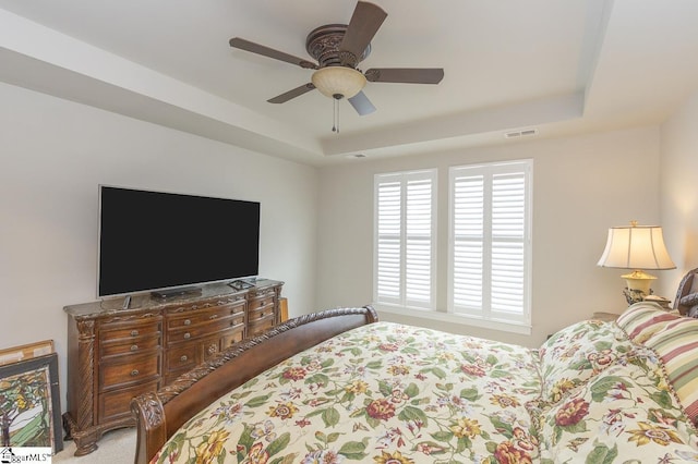 101 Greensdale Ln, Easley, SC 29642 - bedroom with a tray ceiling, a ceiling fan, and carpet flooring