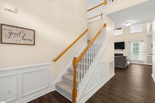 105 Franklin Meadow Way, Greer, SC 29651 - stairway with a towering ceiling, wood finished floors, and a fireplace