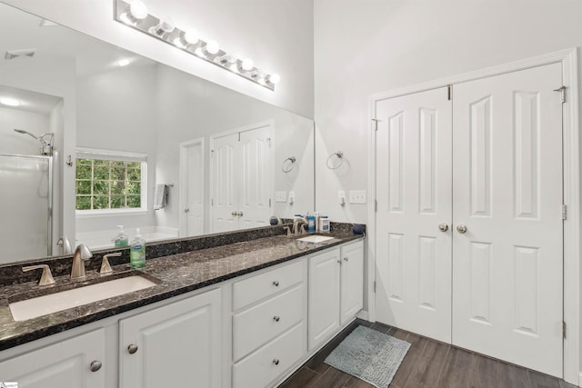 105 Franklin Meadow Way, Greer, SC 29651 - bathroom featuring double vanity, a stall shower, wood finished floors, and a bath