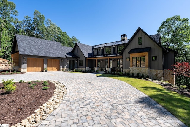 189 Crowne Hill Way, Marietta, SC 29661 - view of front of property with stone siding, board and batten siding, a standing seam roof, and curved driveway