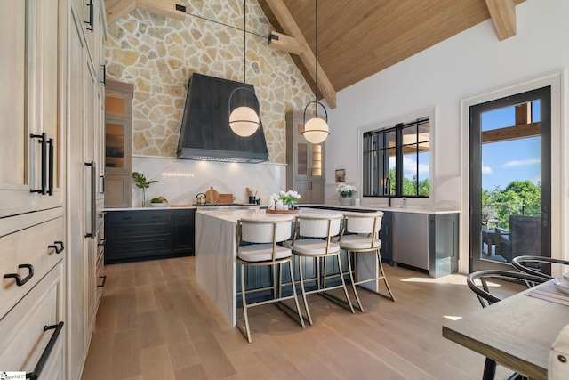 189 Crowne Hill Way, Marietta, SC 29661 - kitchen with wood ceiling, light wood-style flooring, a breakfast bar area, a center island, and light countertops