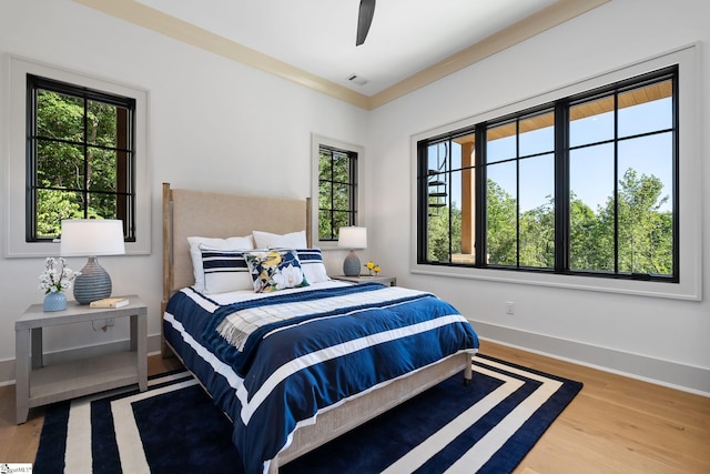 189 Crowne Hill Way, Marietta, SC 29661 - bedroom with multiple windows, wood finished floors, baseboards, and ceiling fan