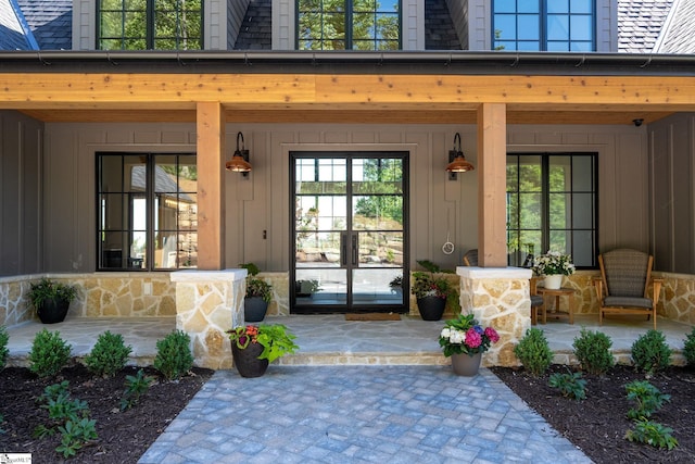 189 Crowne Hill Way, Marietta, SC 29661 - view of exterior entry with covered porch and board and batten siding