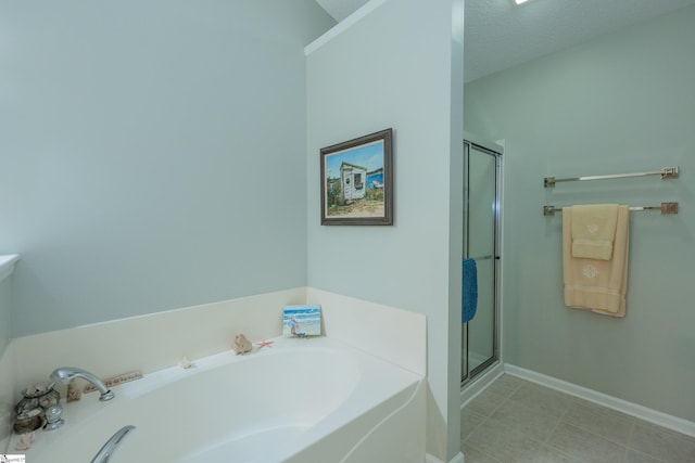 29 River Birch Way, Greer, SC 29650 - bathroom featuring a bath, a stall shower, and baseboards