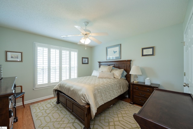 29 River Birch Way, Greer, SC 29650 - bedroom with light wood-type flooring, baseboards, ceiling fan, and a textured ceiling